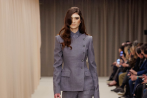 runway image from alexander McQueens aw26 collection, model wears mask